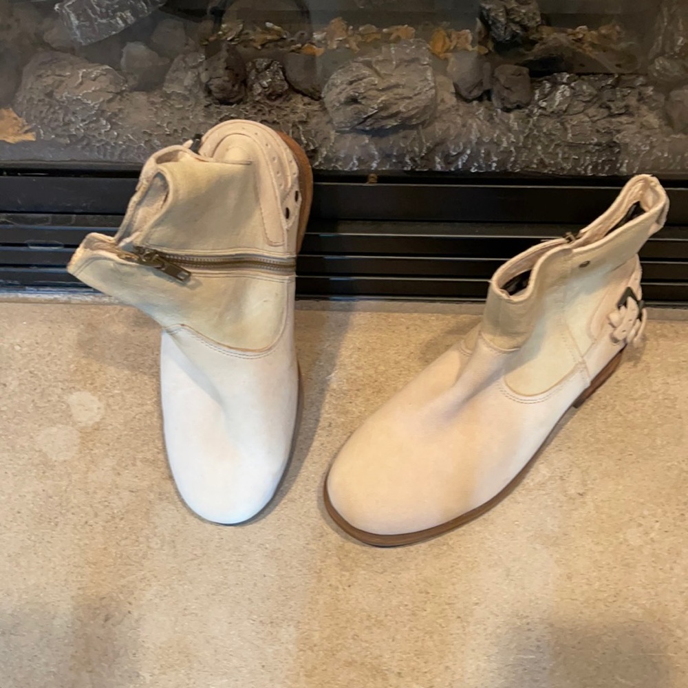 UGG winter white zip up ankle boot.